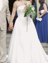 Stijlvolle strapless trouwjapon met losse overrok en losse strik
